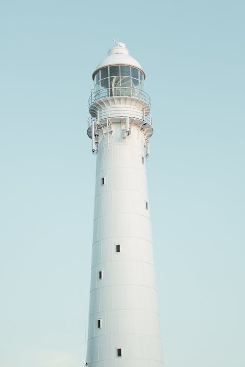 Slangkop Lighthouse on the Background of a Blue Sky 