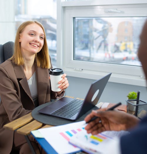 A Woman Having a Meeting During Coffee Break