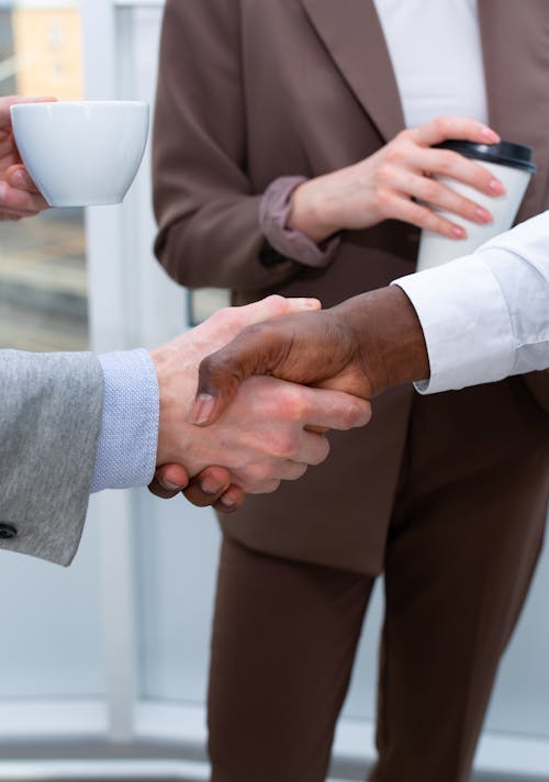 Free People Shaking Hands in a Meeting Stock Photo