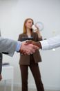 Man in Gray Suit Holding Womans Hand