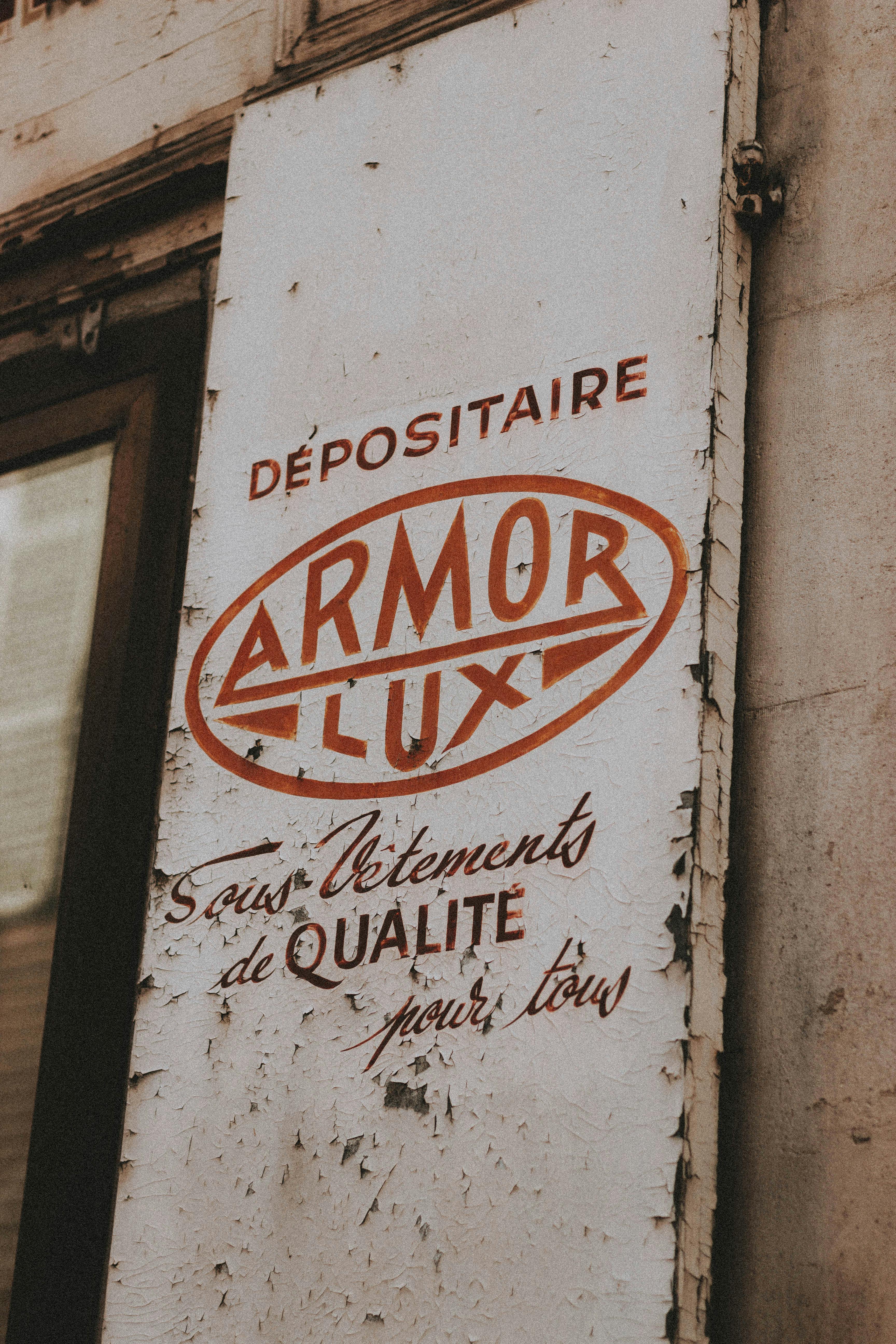 aged shabby signboard with inscription