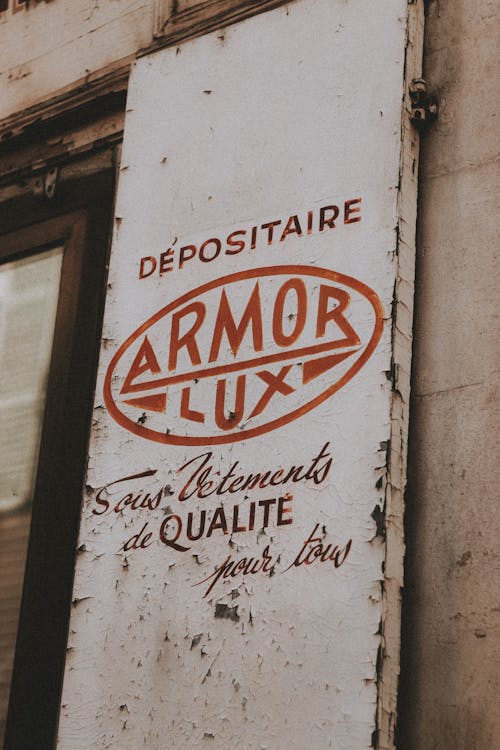 Aged shabby signboard with inscription