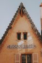 Old shabby house with Boucherie signboard