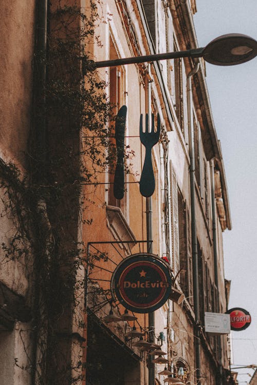 Signboard of cafe on building in city