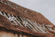 Brown Wooden Roof Under White Sky
