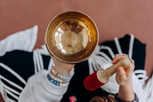 A Person Holding Tibetan Singing Bowl