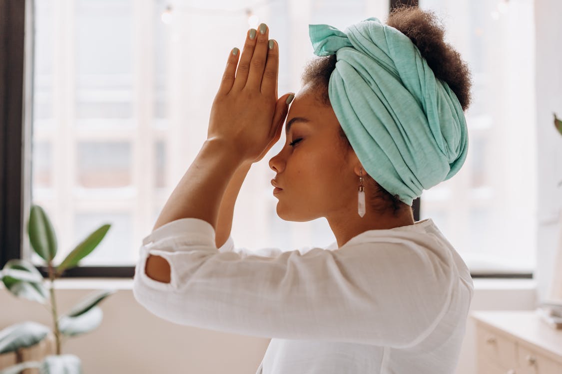 Free Woman in White Long Sleeve Shirt With Blue Towel on Head Stock Photo