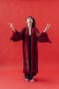 Woman in Red and Brown Long Sleeve Dress