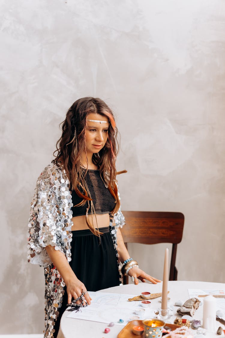 A Psychic Woman Standing By A Table