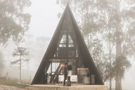 A Couple in Front of a Triangular House