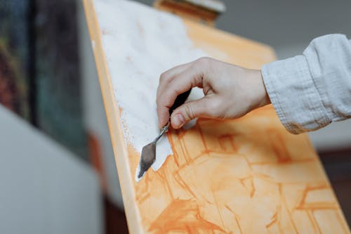 A Person Painting on a Canvas