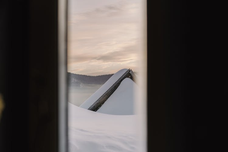 Snow Covered Roof Of A House