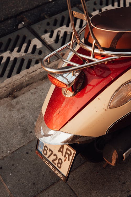 Free Colorful scooter with leather seat on street Stock Photo
