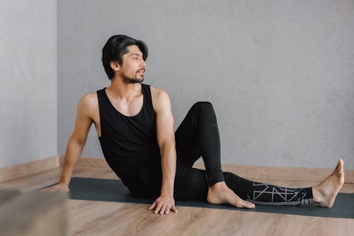 Free Person in Black Tank Top Exercising Stock Photo