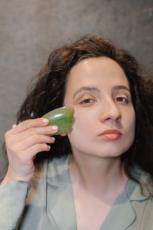 A Woman Massaging Her Face