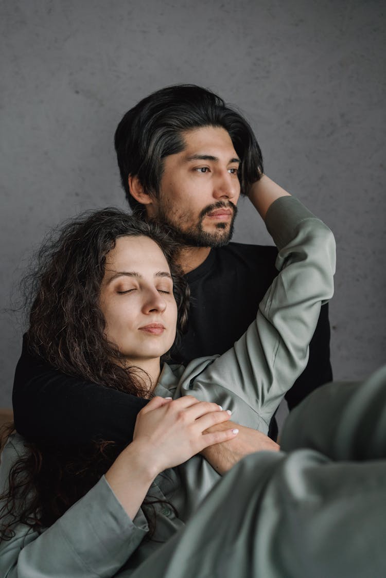 A Couple In Hugging Position At Home