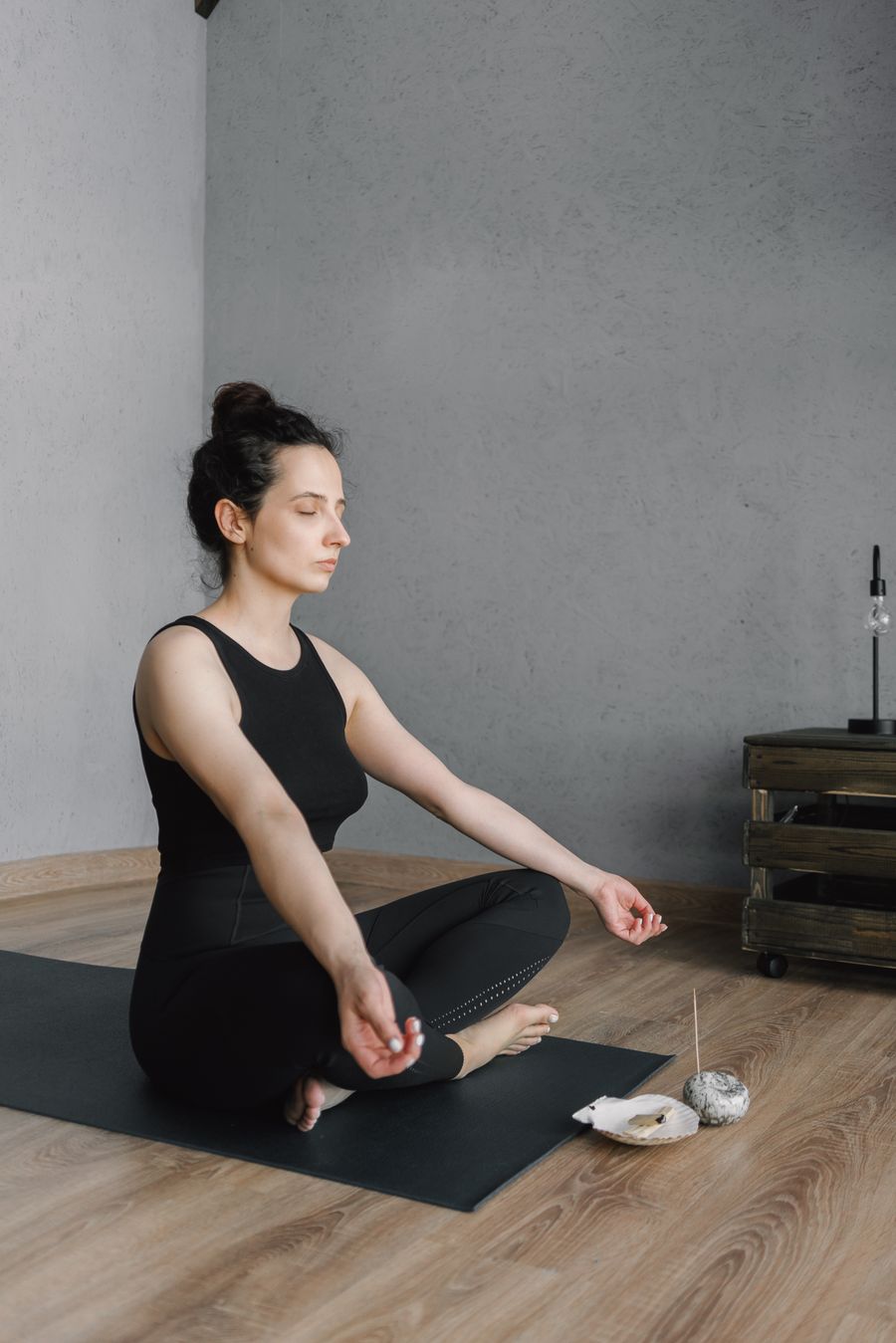 Client resting in meditation surrounded by candles during soul healing