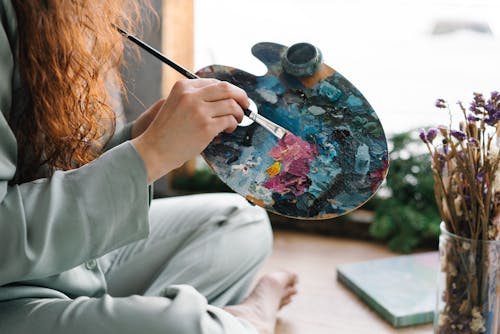 Free A Painter Holding a Brush and Color Palette Stock Photo