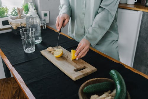 A Person Slicing a Lemon