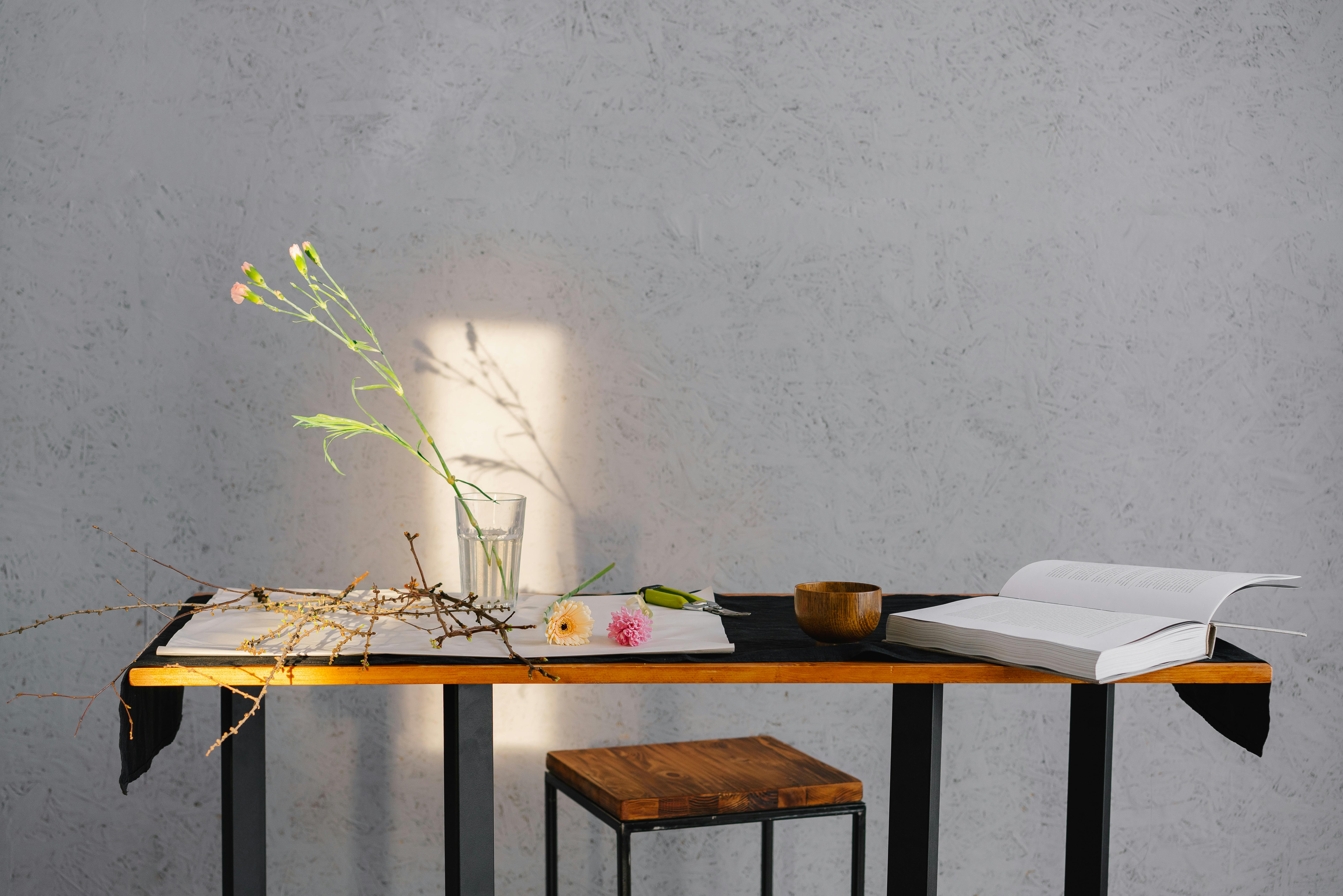 brown wooden table with white printer paper on top