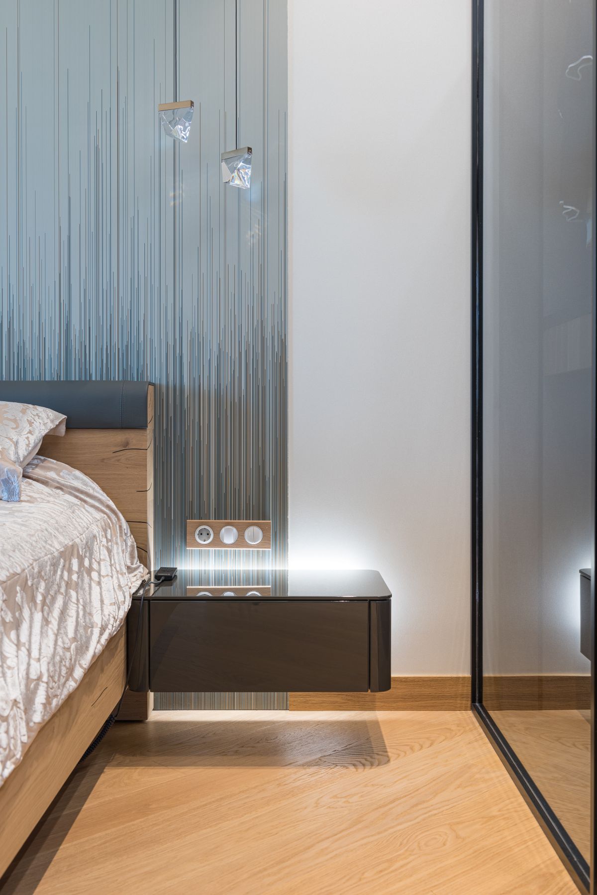 Modern bedroom with bedside table and wardrobe