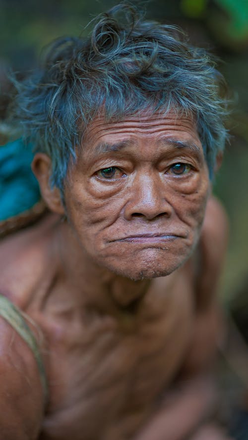 Senior ethnic man with wrinkled skin outdoors