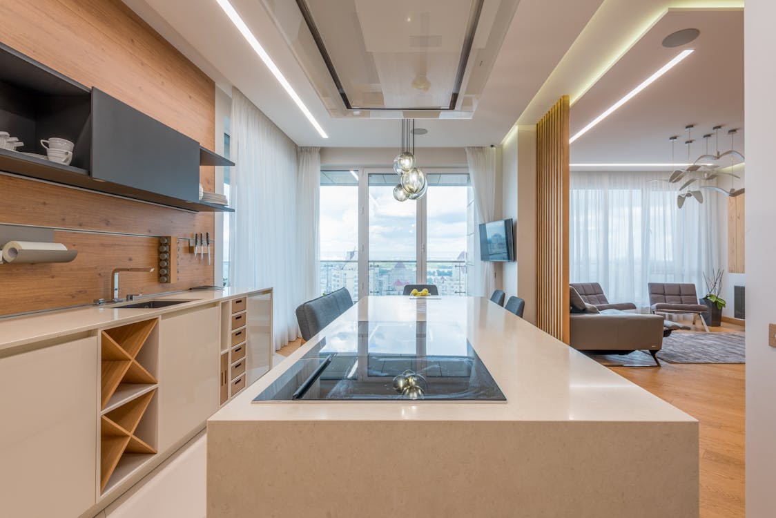 Modern interior of spacious kitchen and living room in daytime