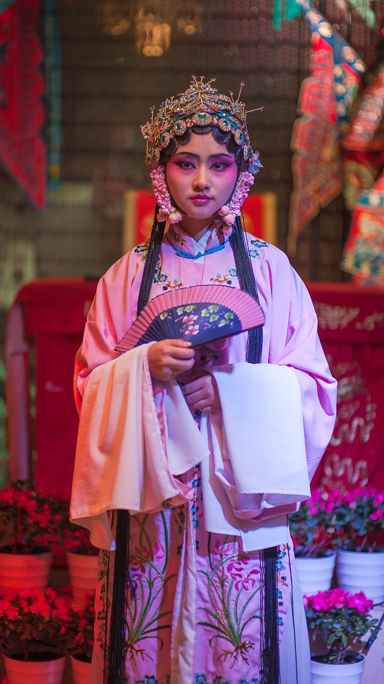 Asian Actress In Traditional Clothes With Fan