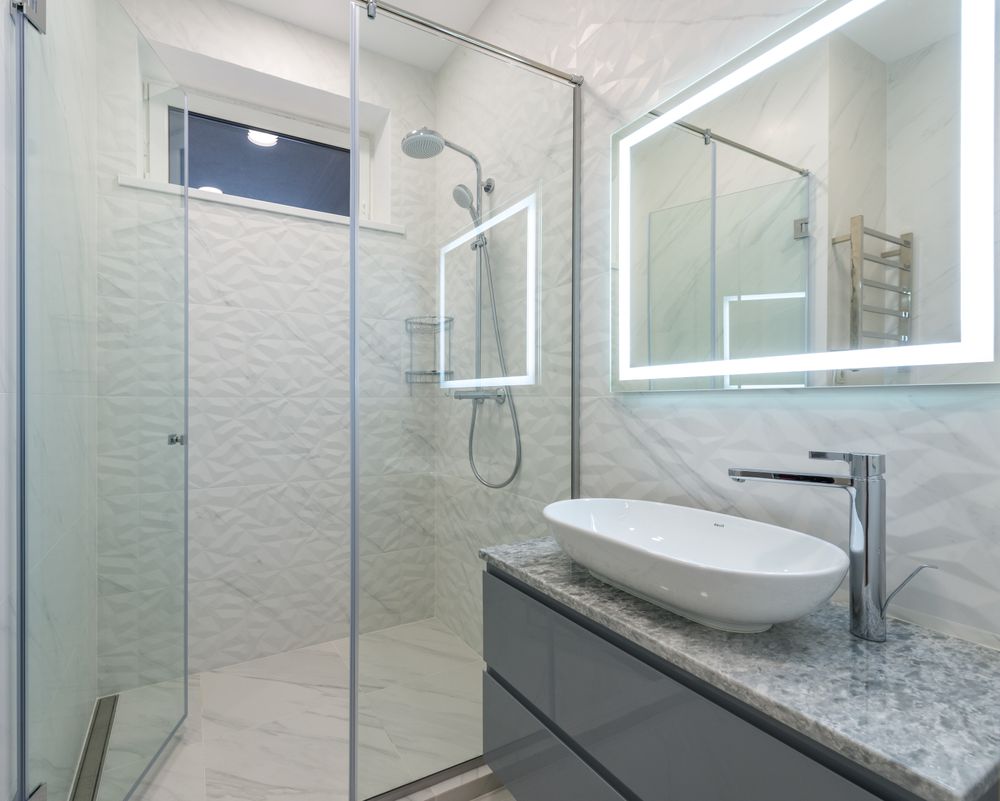 Tub-to-shower conversion in an older Lake Arrowhead cabin bathroom