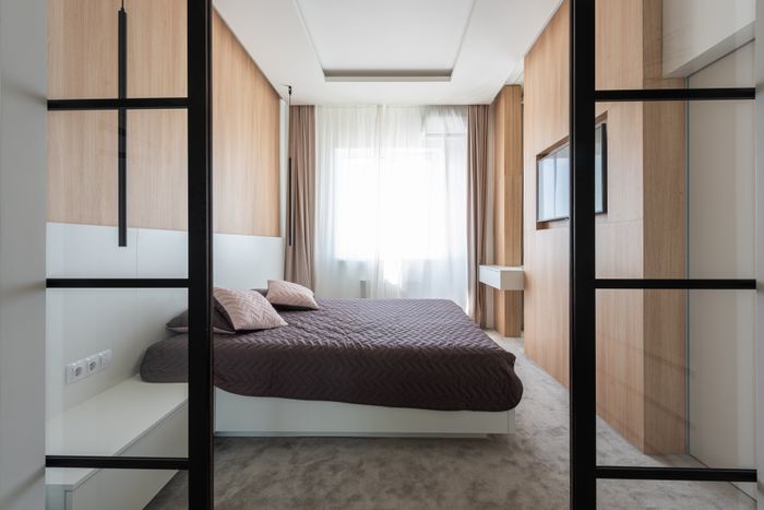 Light bedroom with a low platform bed, photo by Max Vakhtbovych on Pexels