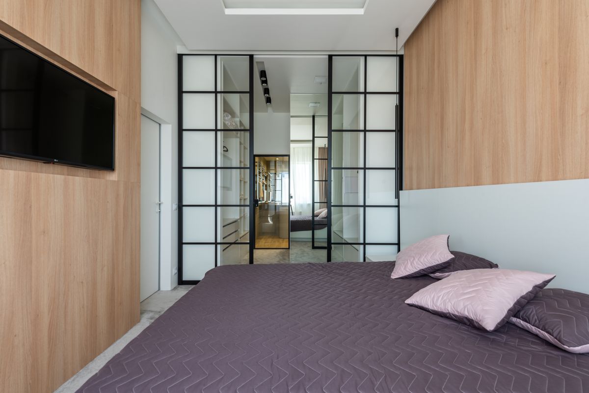 Bedroom interior with glass doors and windows