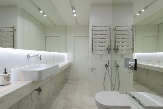 Elegant bathroom design with sleek fixtures and marble surfaces.