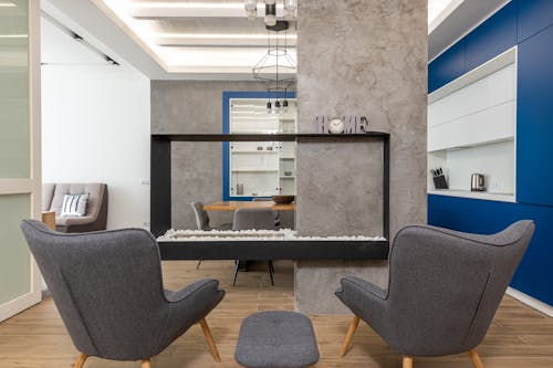 Interior of modern apartment with armchairs in kitchen