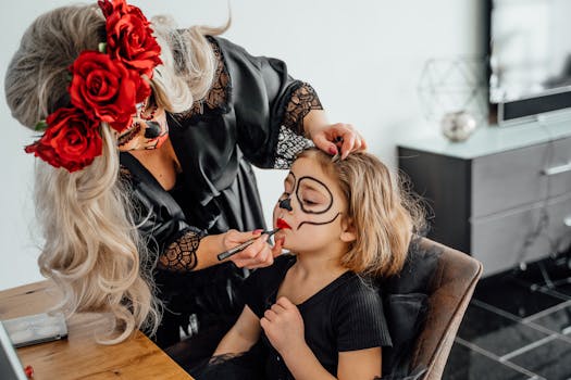 A woman applies Day of the Dead face paint to a child's face, capturing a vibrant cultural moment.