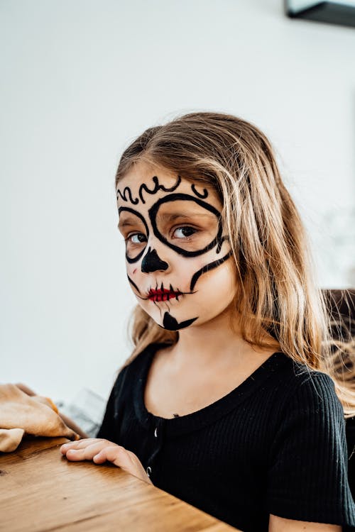 A Girl with Halloween Make-up Looking at the Camera