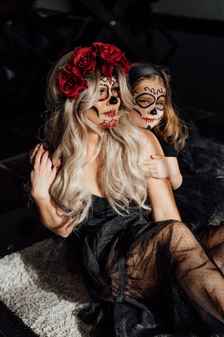 Mother And Daughter In Their Halloween Costume And Makeup