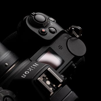 Detailed close-up of a Nikon camera showcasing buttons and lens on a dark background.
