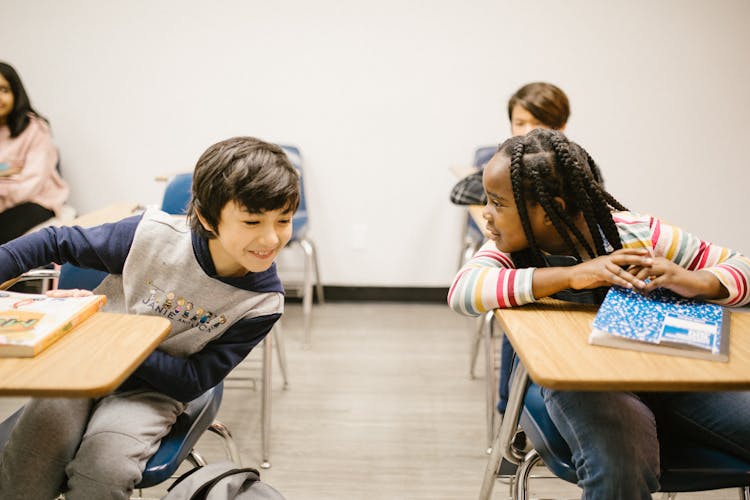 Two Students Talking To Each Other