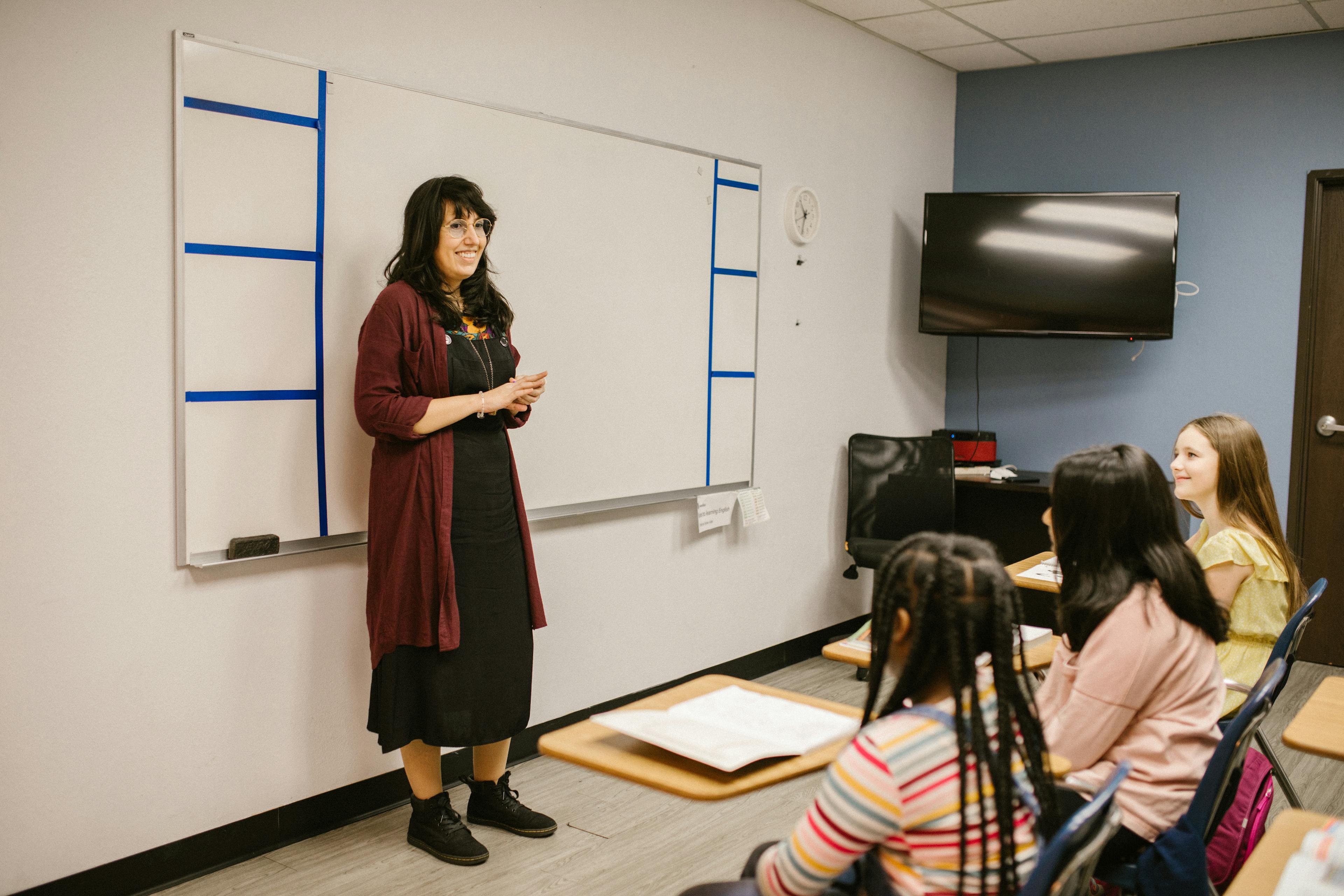 Teacher Discussing Her Lesson With Her Students