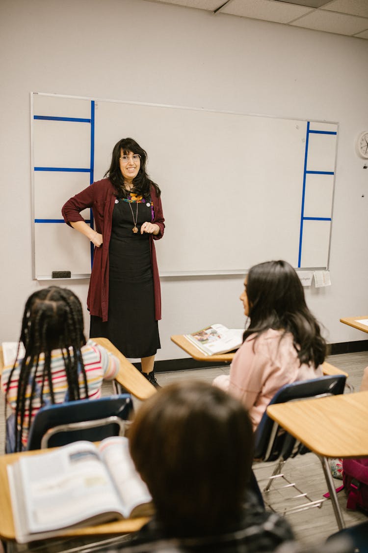 Teacher Discussing Her Lesson With Her Students