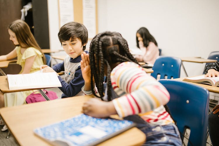 Two Students Talking To Each Other