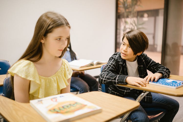 Two Students Talking To Each Other