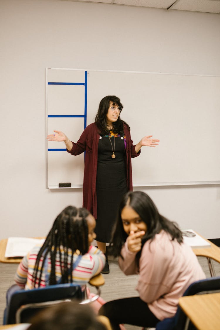 Two Students Talking To Each Other