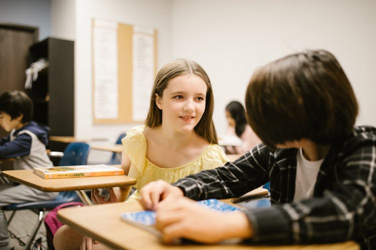 Two Students Talking To Each Other