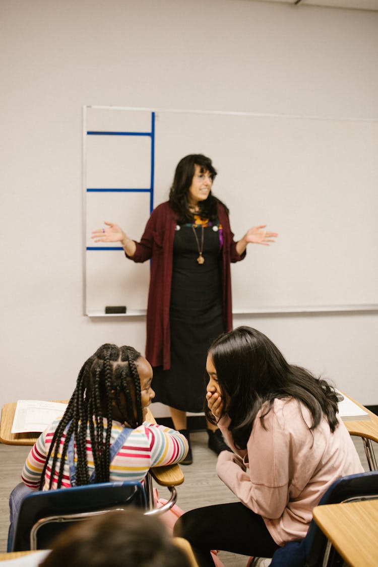 Two Students Talking To Each Other