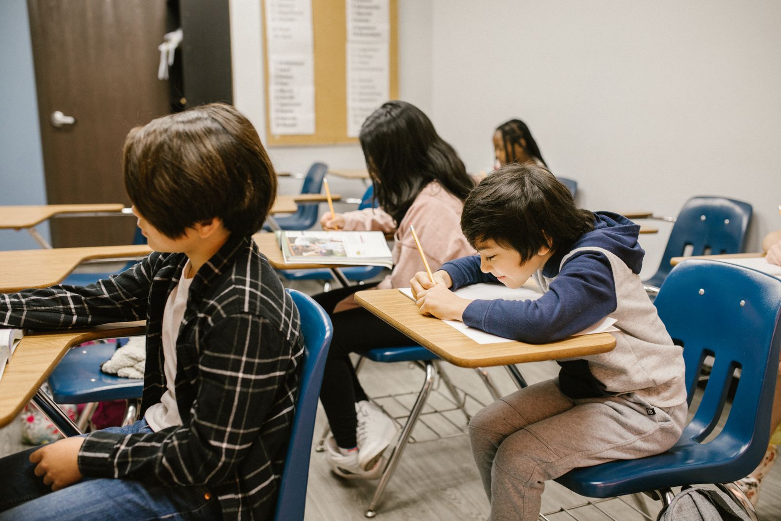 Students studying together in a diverse classroom