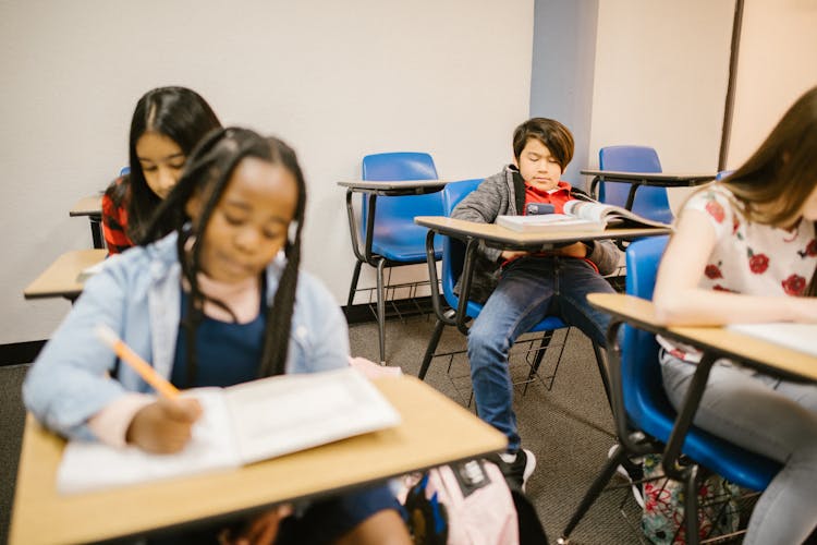 Boy Taking Photo Of His Classmate