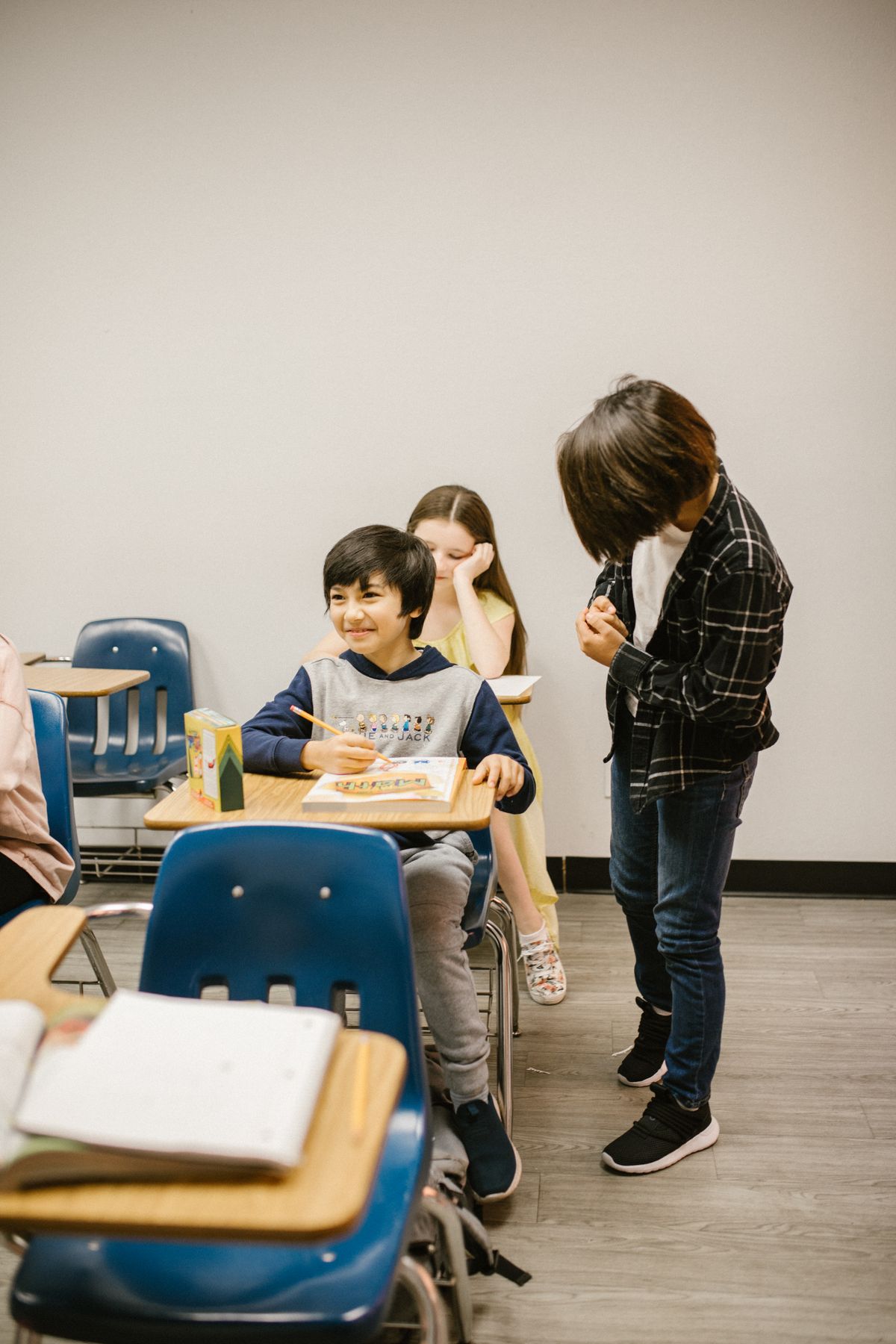 Young students in classroom setting engaged in learning