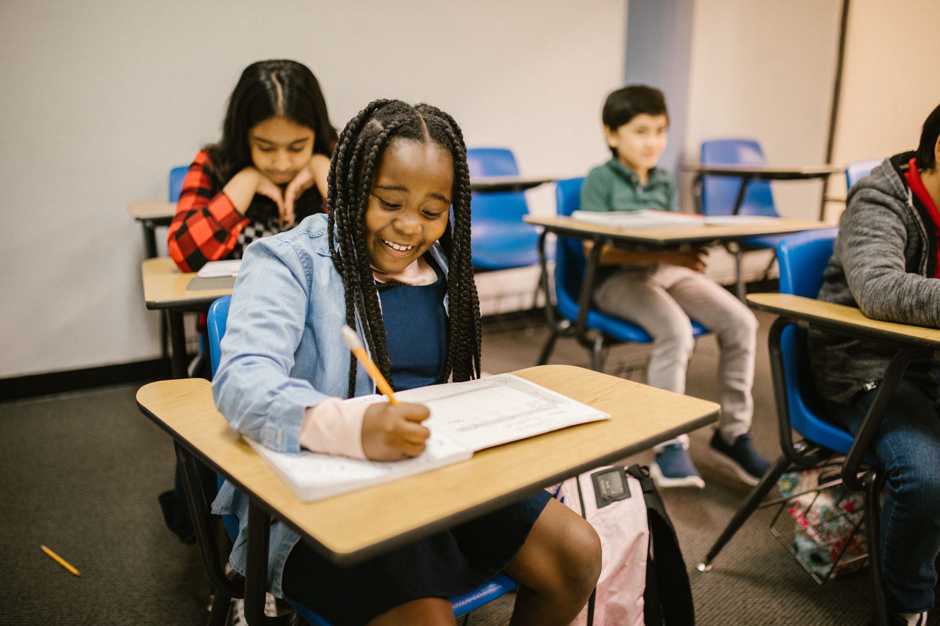 Girl Laughing While Writing
