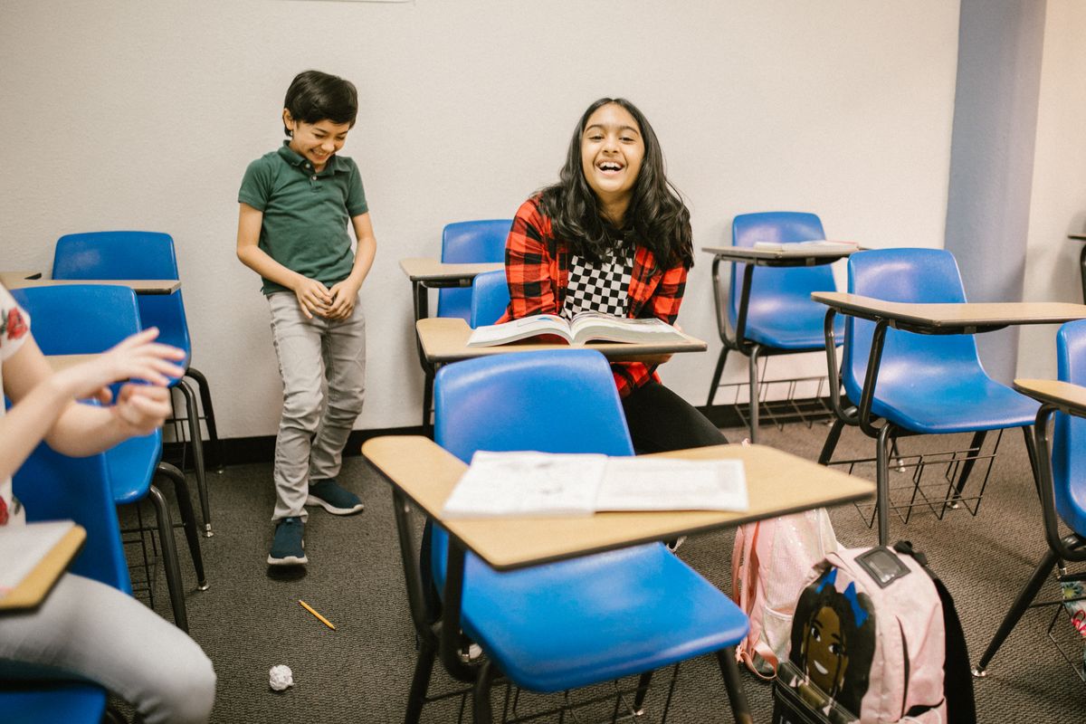 Middle school students laughing together
